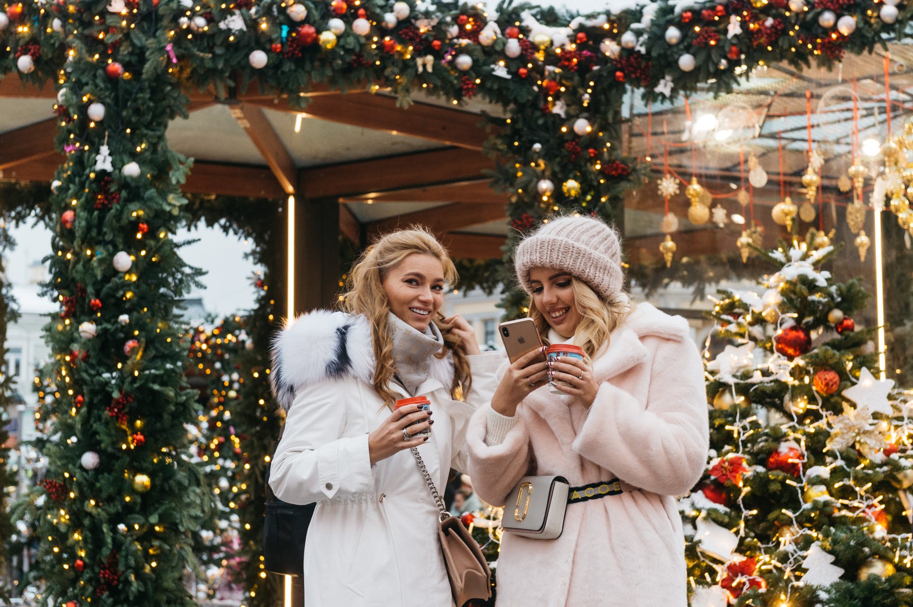 two women near christmas decorations